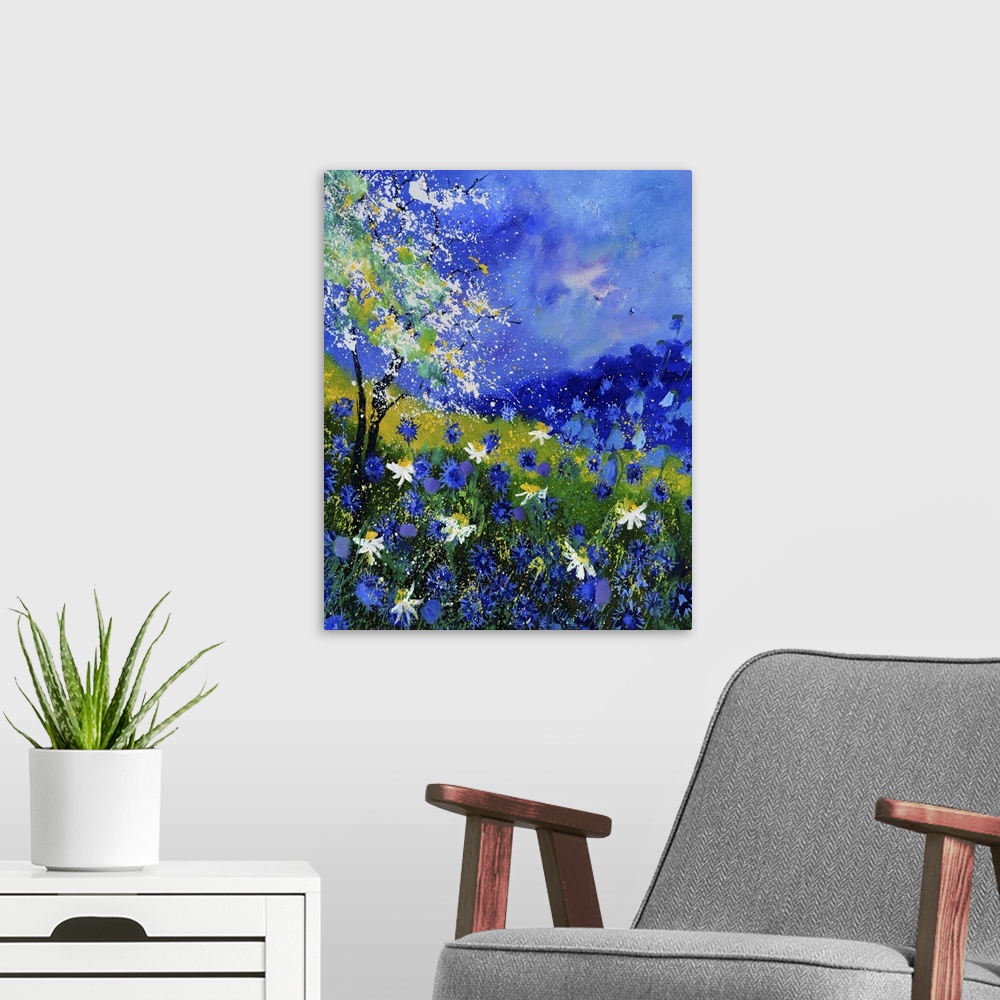 A modern room featuring Vertical painting of colorful flowers in a garden and a bright blue sky with small speckles of pa...