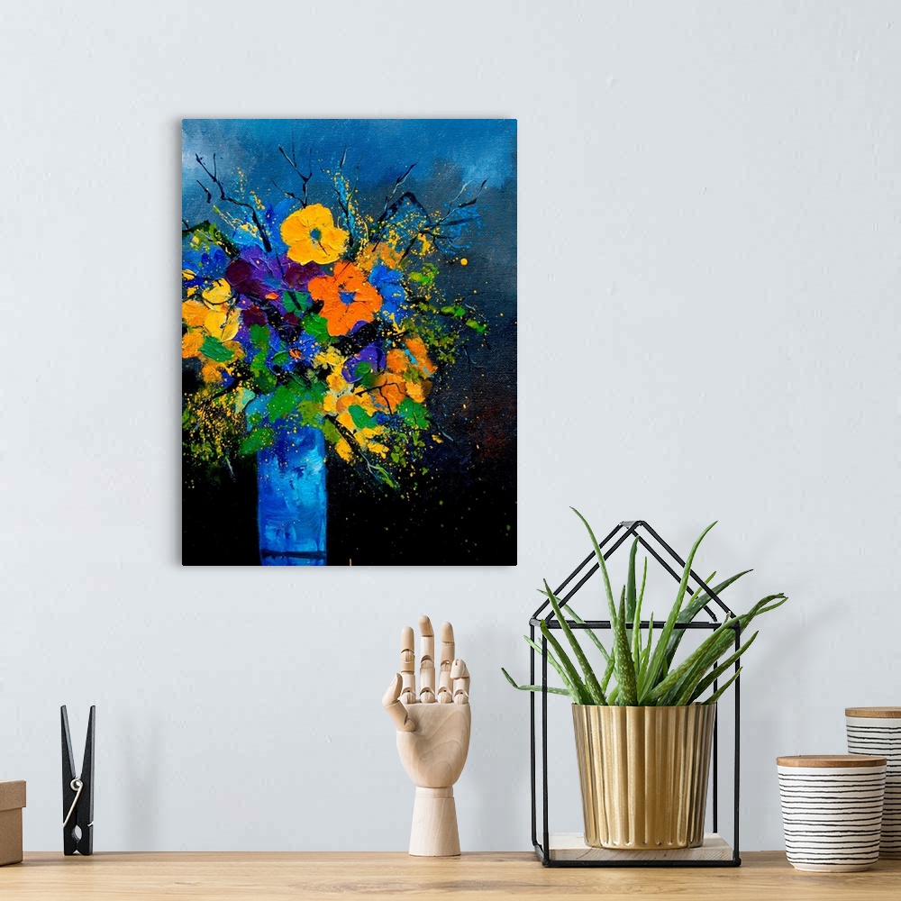 A bohemian room featuring Vertical painting of a vase of flowers against a blue tone background.