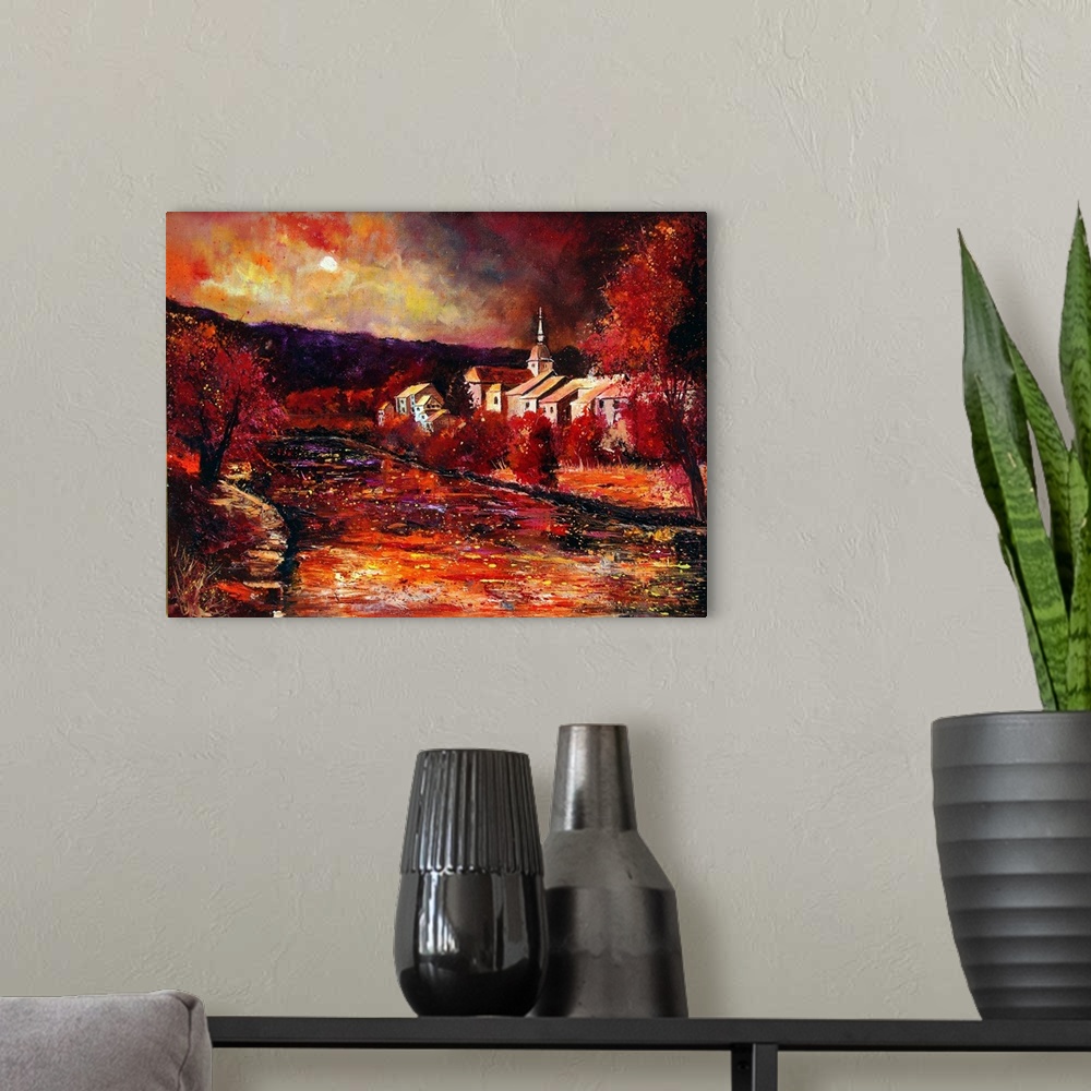 A modern room featuring Horizontal painting of the town of Chassepierre in Belgium in vibrant shades of red.