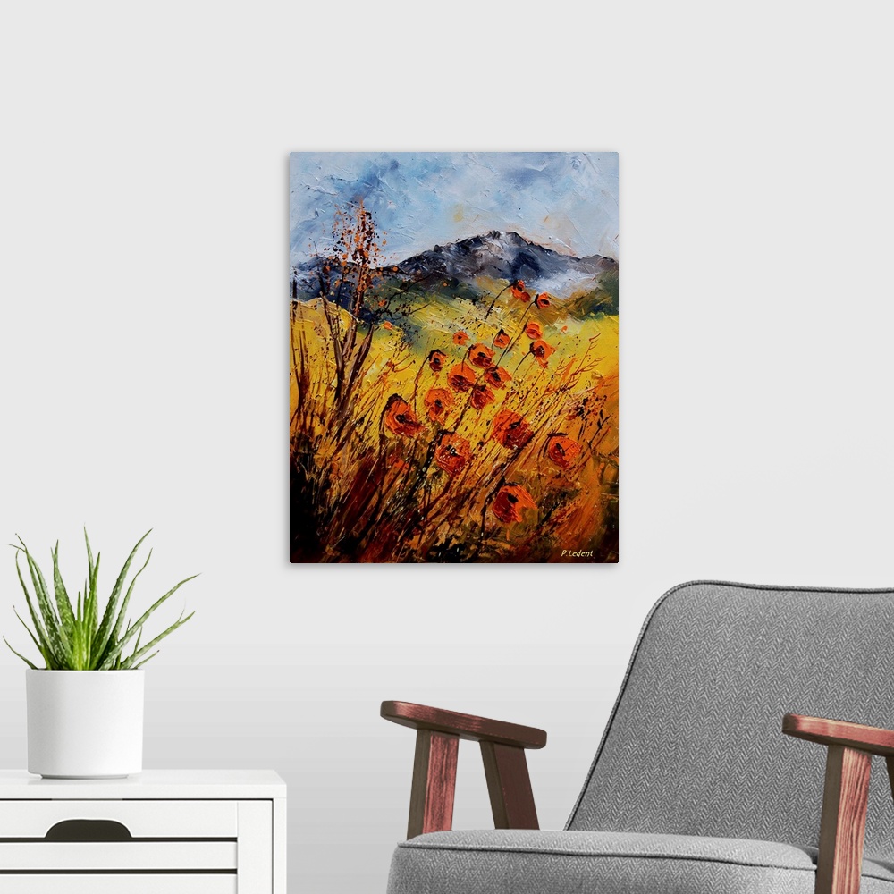 A modern room featuring A vertical country landscape of orange wildflowers in a field with mountains in the background.