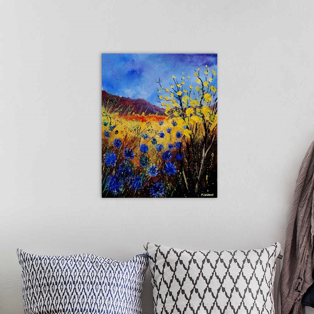 A bohemian room featuring Contemporary painting of a field of cornflowers in blue, yellow and orange.