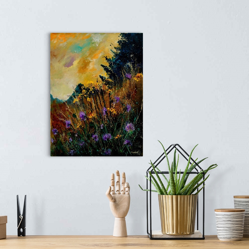 A bohemian room featuring Contemporary painting of a field of purple cornflowers aligned with trees with a vibrant yellow sky.