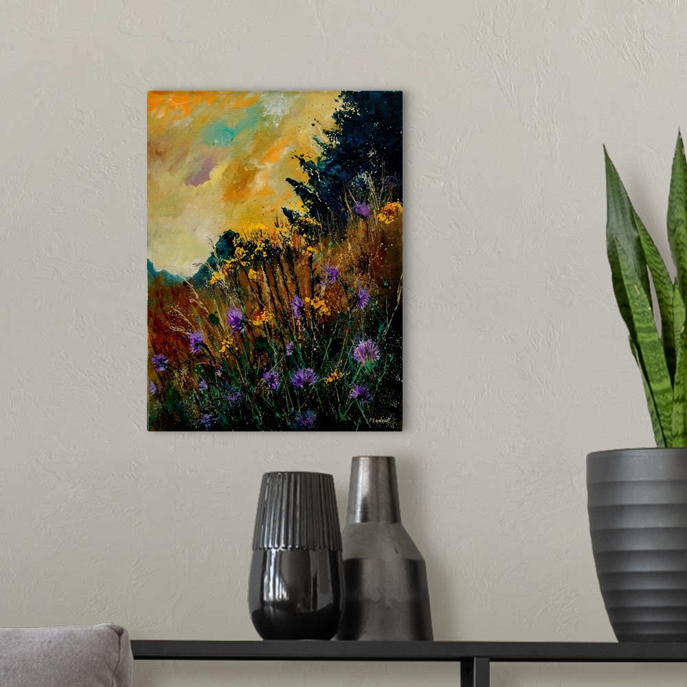 A modern room featuring Contemporary painting of a field of purple cornflowers aligned with trees with a vibrant yellow sky.