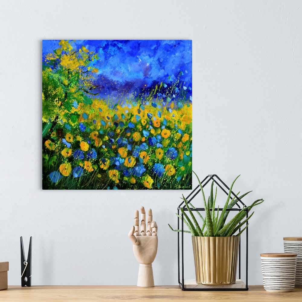 A bohemian room featuring Contemporary landscape painting of a field of blue and yellow cornflowers.