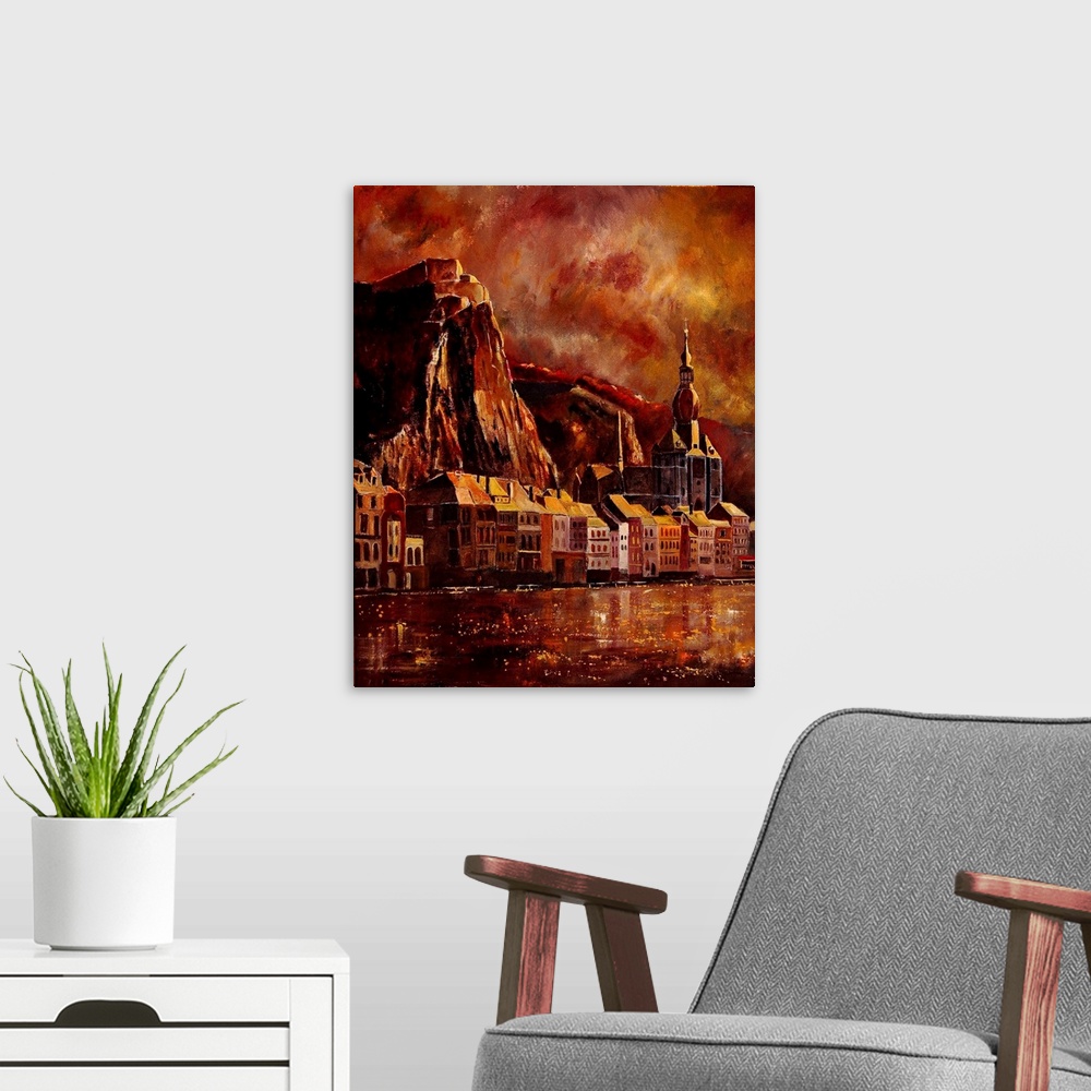 A modern room featuring A solemn painting of the city of Dinant in Belgium in warm colors of red.