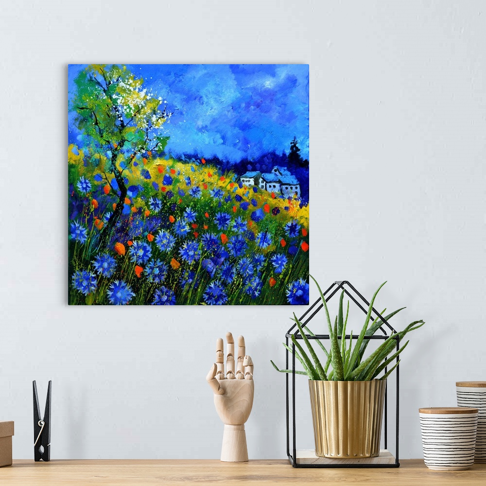 A bohemian room featuring Vibrant painting of a bright Summer day with blossoming flowers, a colorful sky, and a house in t...