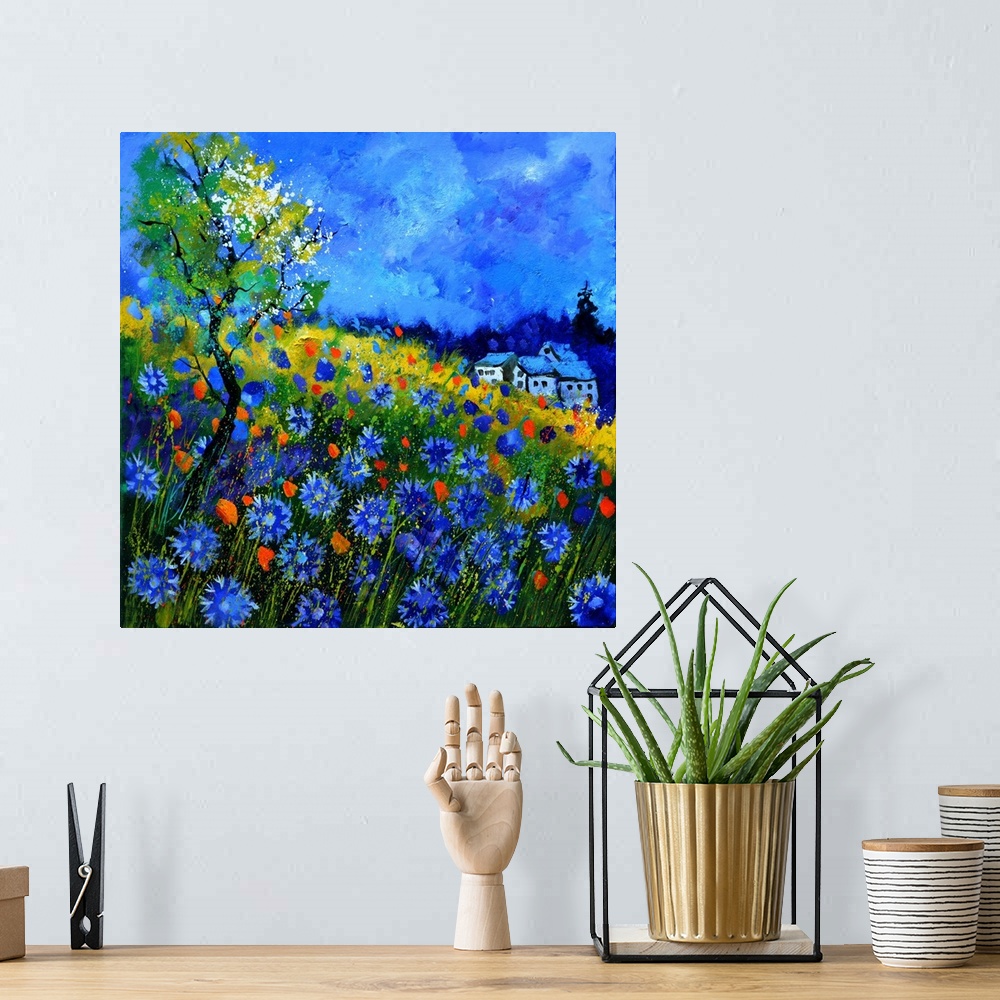 A bohemian room featuring Vibrant painting of a bright Summer day with blossoming flowers, a colorful sky, and a house in t...