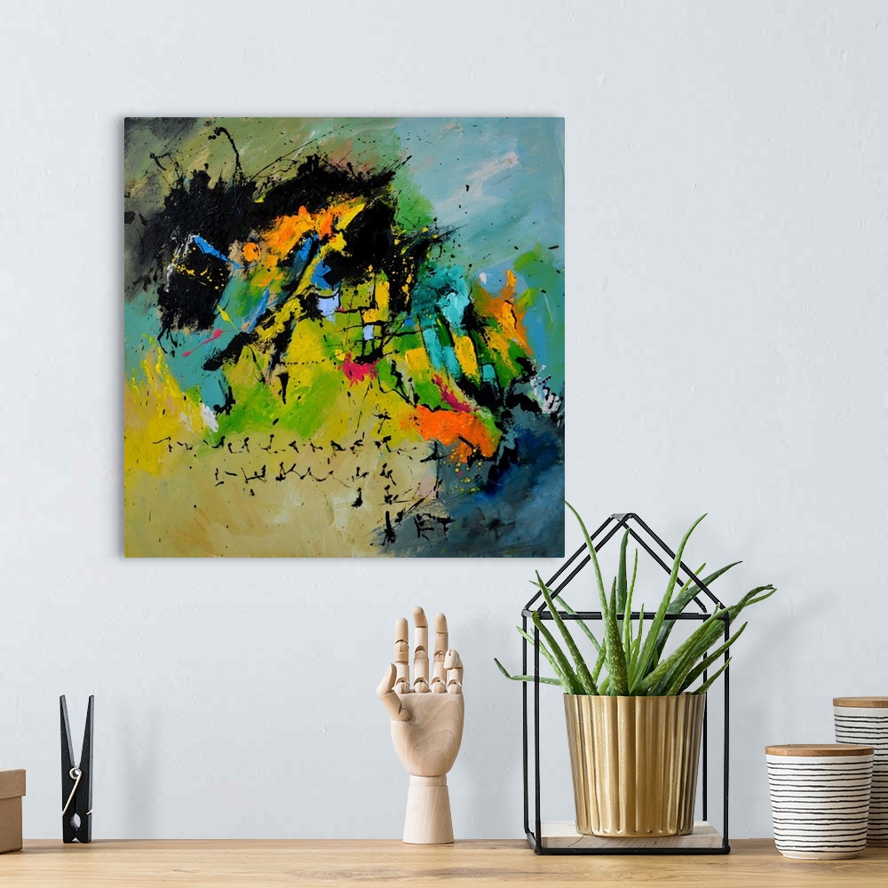 A bohemian room featuring A square abstract painting in muted shades of green, blue, orange and yellow with splatters of pa...