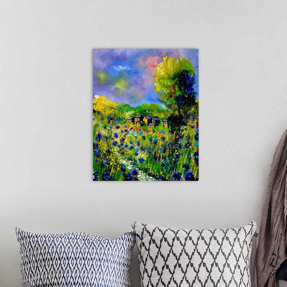 A bohemian room featuring Vertical painting of a field of flowers with a house in the background with splatters of multi-co...