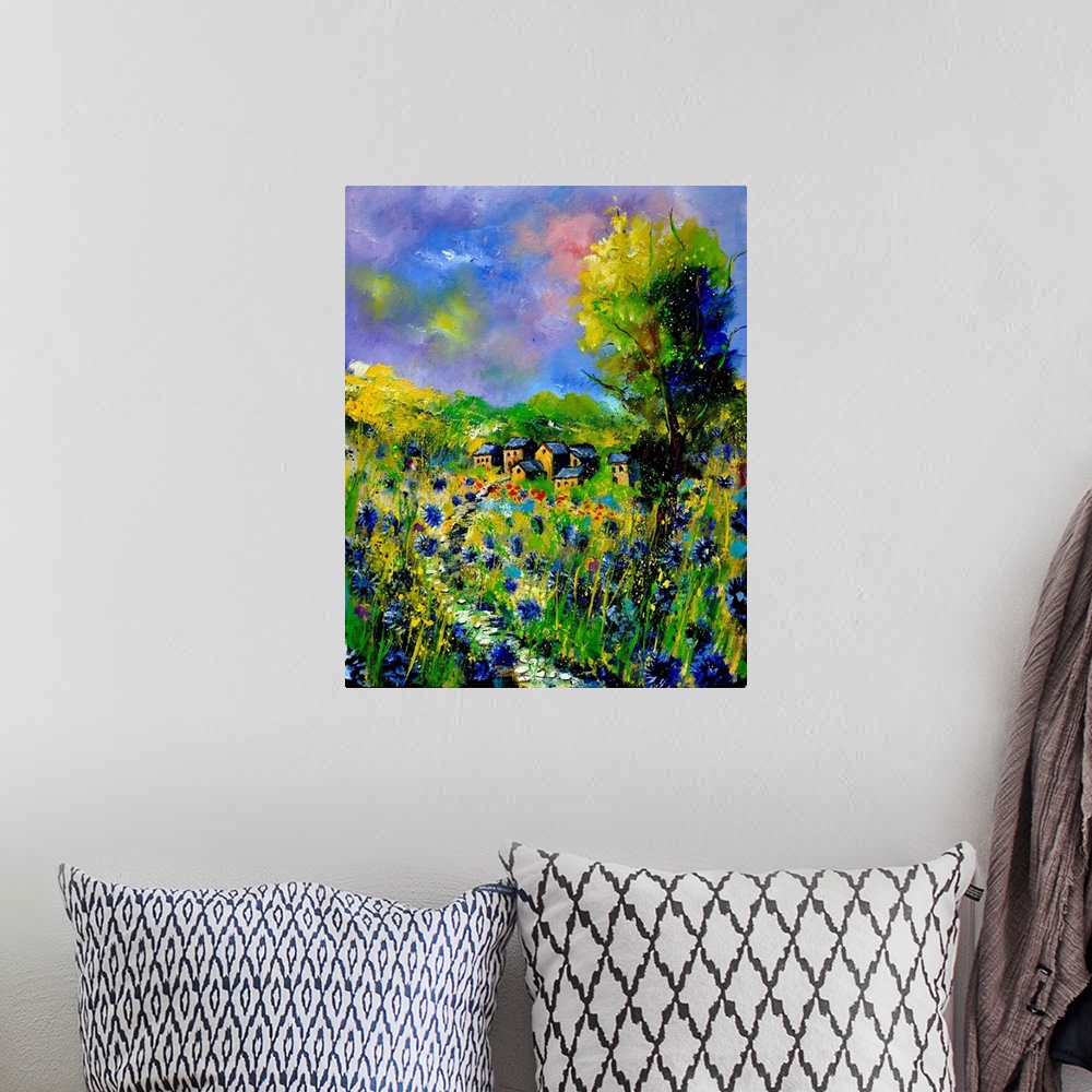 A bohemian room featuring Vertical painting of a field of flowers with a house in the background with splatters of multi-co...