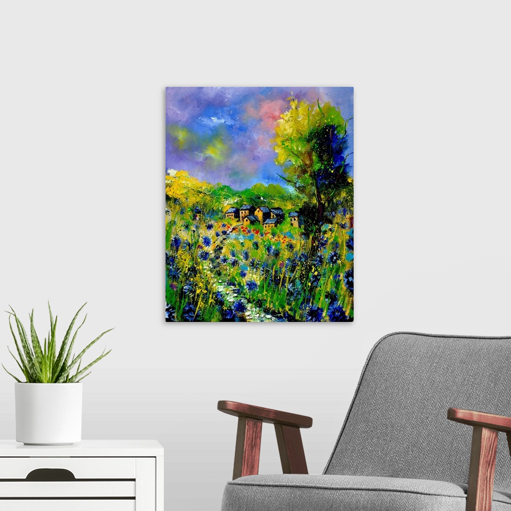 A modern room featuring Vertical painting of a field of flowers with a house in the background with splatters of multi-co...