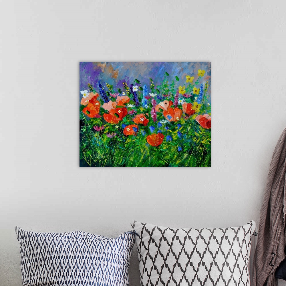 A bohemian room featuring Horizontal painting of colorful flowers in a garden and a bright blue sky with small speckles of ...