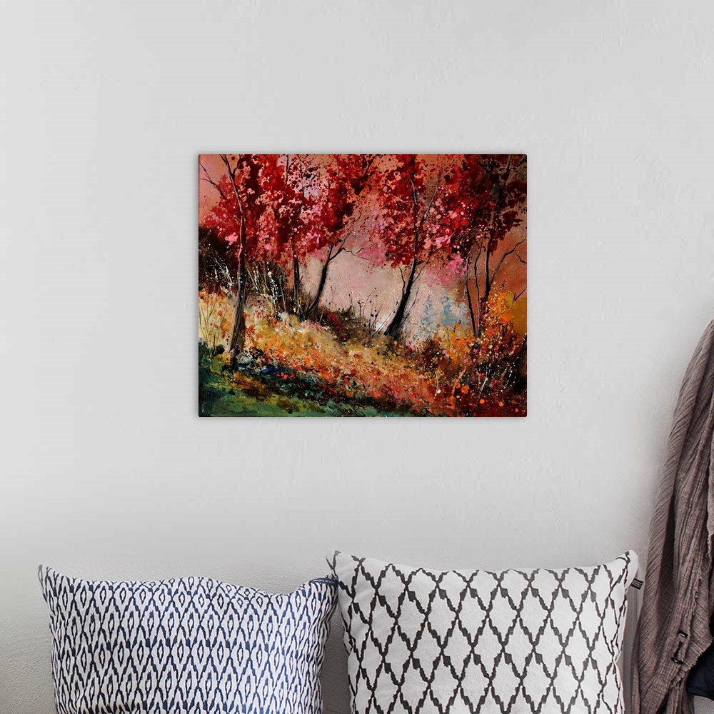 A bohemian room featuring Landscape painting of a group of red leaved trees in the fall with speckles of paint overlapping.