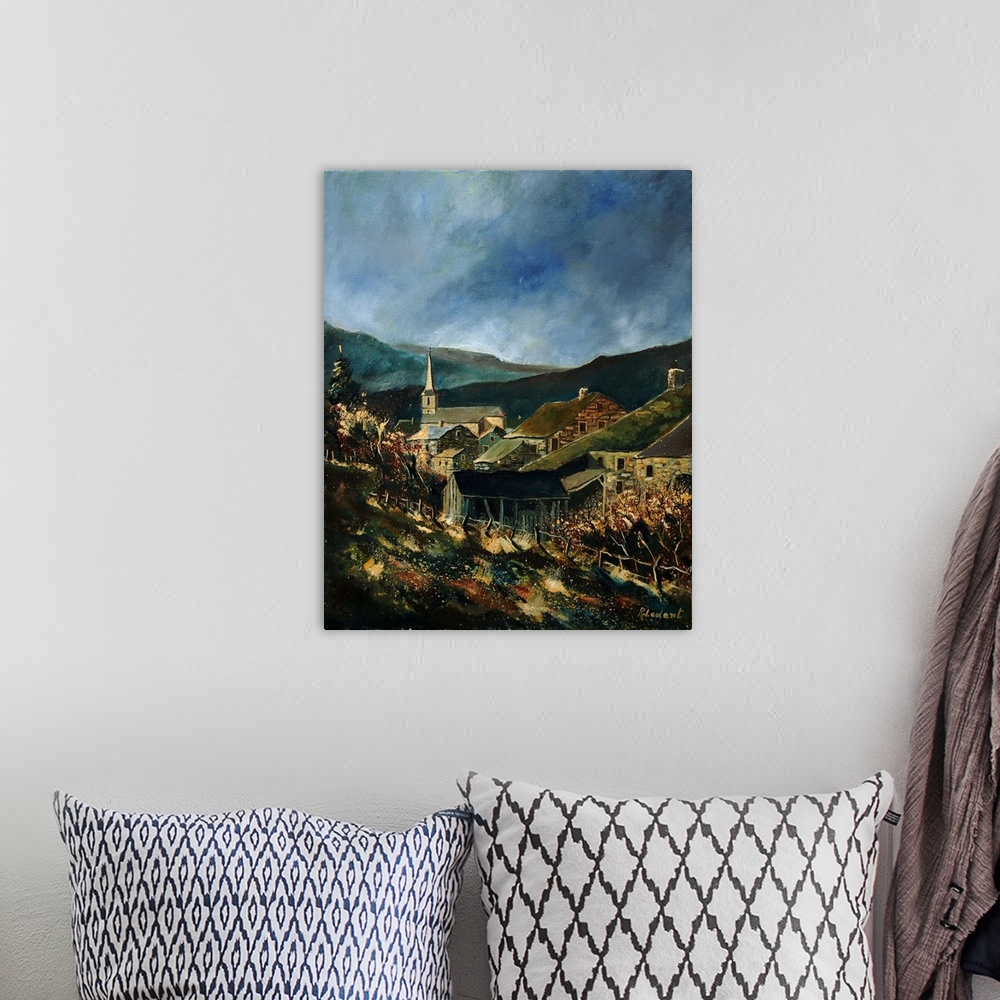 A bohemian room featuring A vertical painting of the the village of Agimont in Belgium.