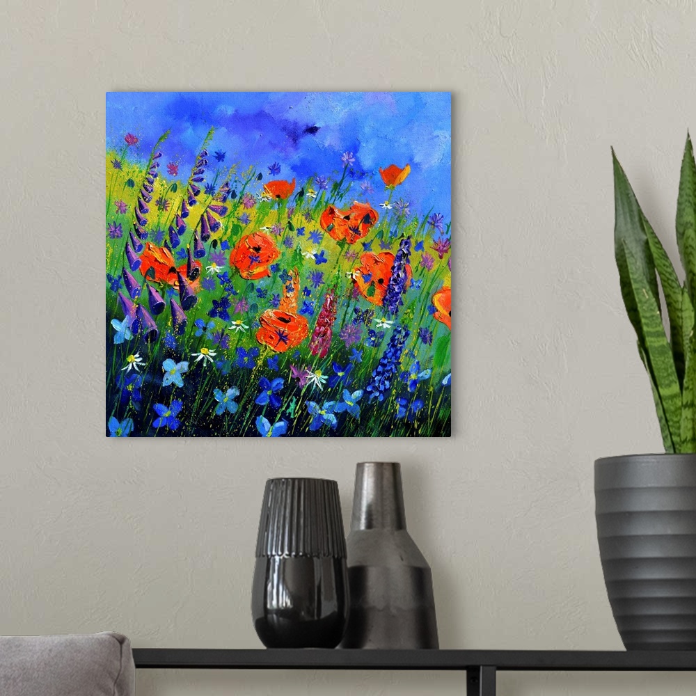 A modern room featuring Square painting of colorful flowers in a garden and a bright blue sky with small speckles of pain...