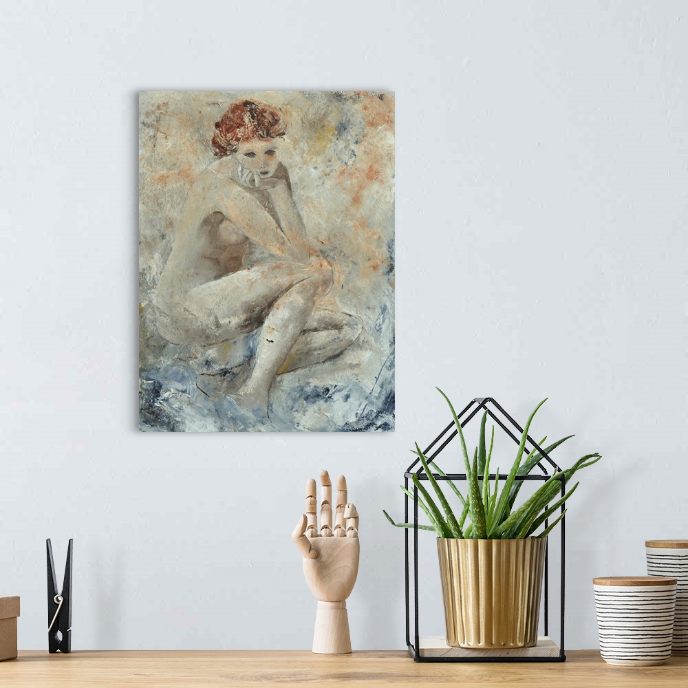 A bohemian room featuring A portrait of a nude woman resting her chin on her hand as she sits, done in textured neutral tones.