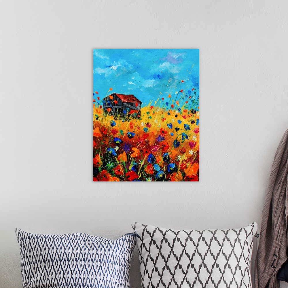 A bohemian room featuring Vertical painting of a field of orange and blue poppies with a barn and splatters of multi-color ...