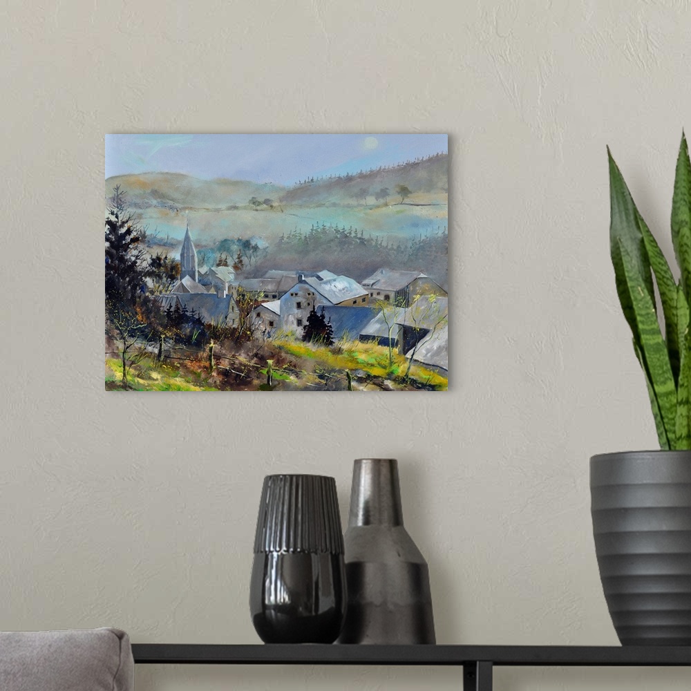 A modern room featuring Horizontal painting of an overcast day with a village surrounded by fog and mountains in the dist...