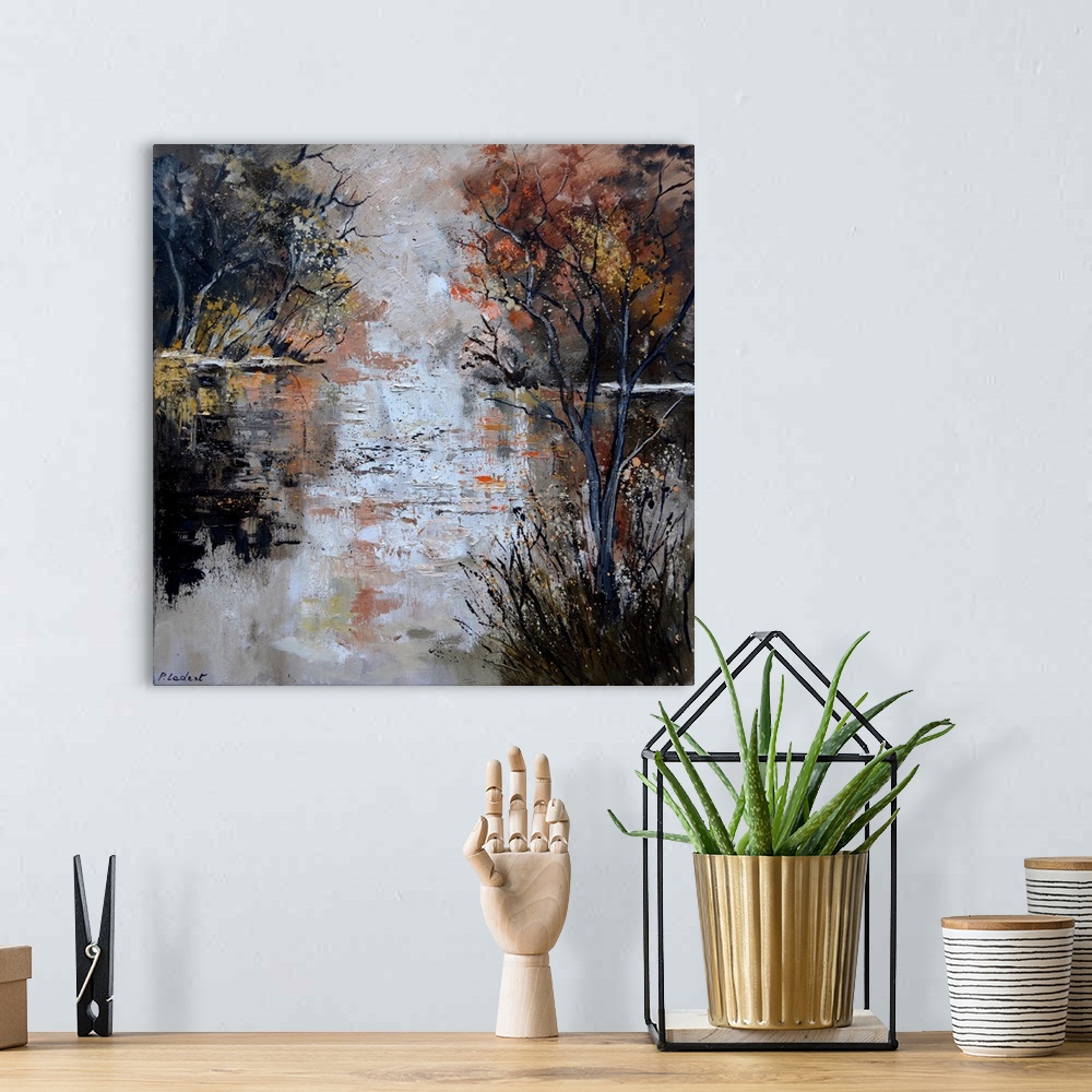 A bohemian room featuring Abstract painting of a reflecting pond on an Autumn day lined with trees.
