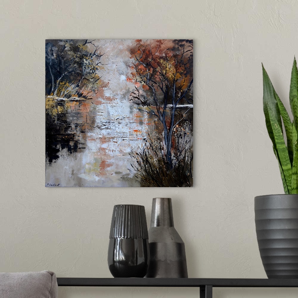 A modern room featuring Abstract painting of a reflecting pond on an Autumn day lined with trees.