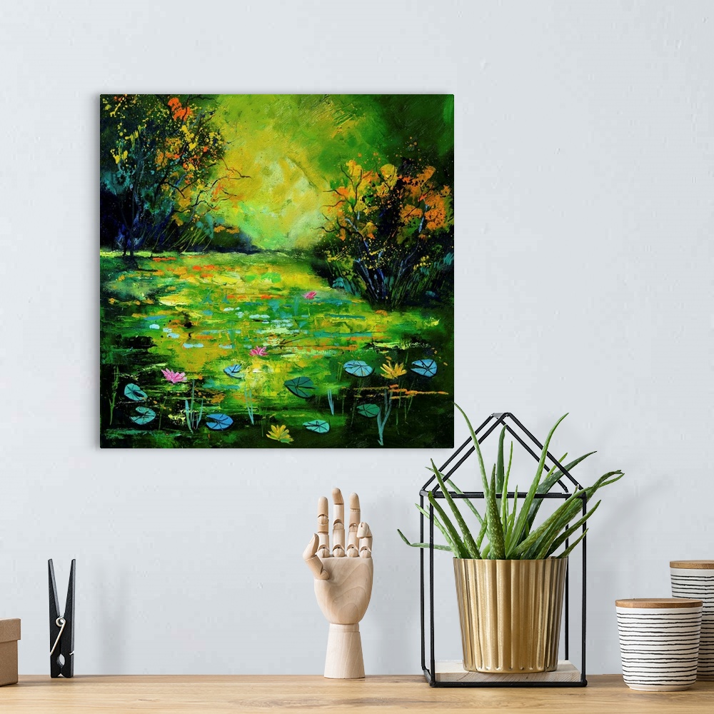 A bohemian room featuring Square painting of a pond scene with blue and green water lilies as well as flower blooms and sma...