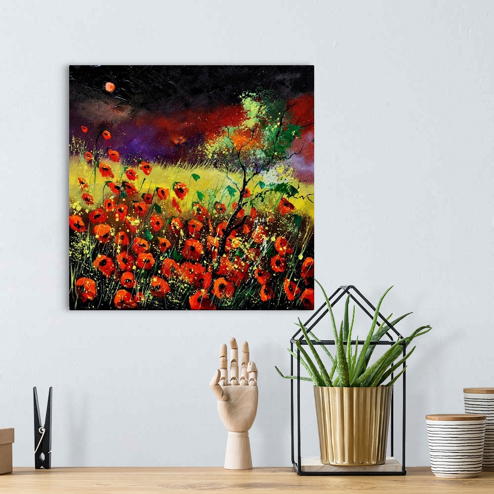 A bohemian room featuring Vibrant painting of red poppies in a filed with a dark, red sky in the distance.