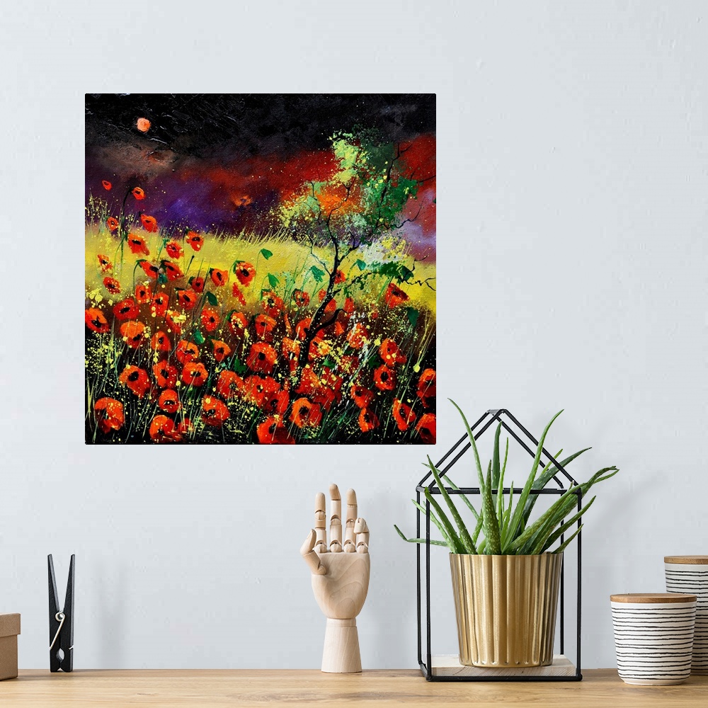 A bohemian room featuring Vibrant painting of red poppies in a filed with a dark, red sky in the distance.