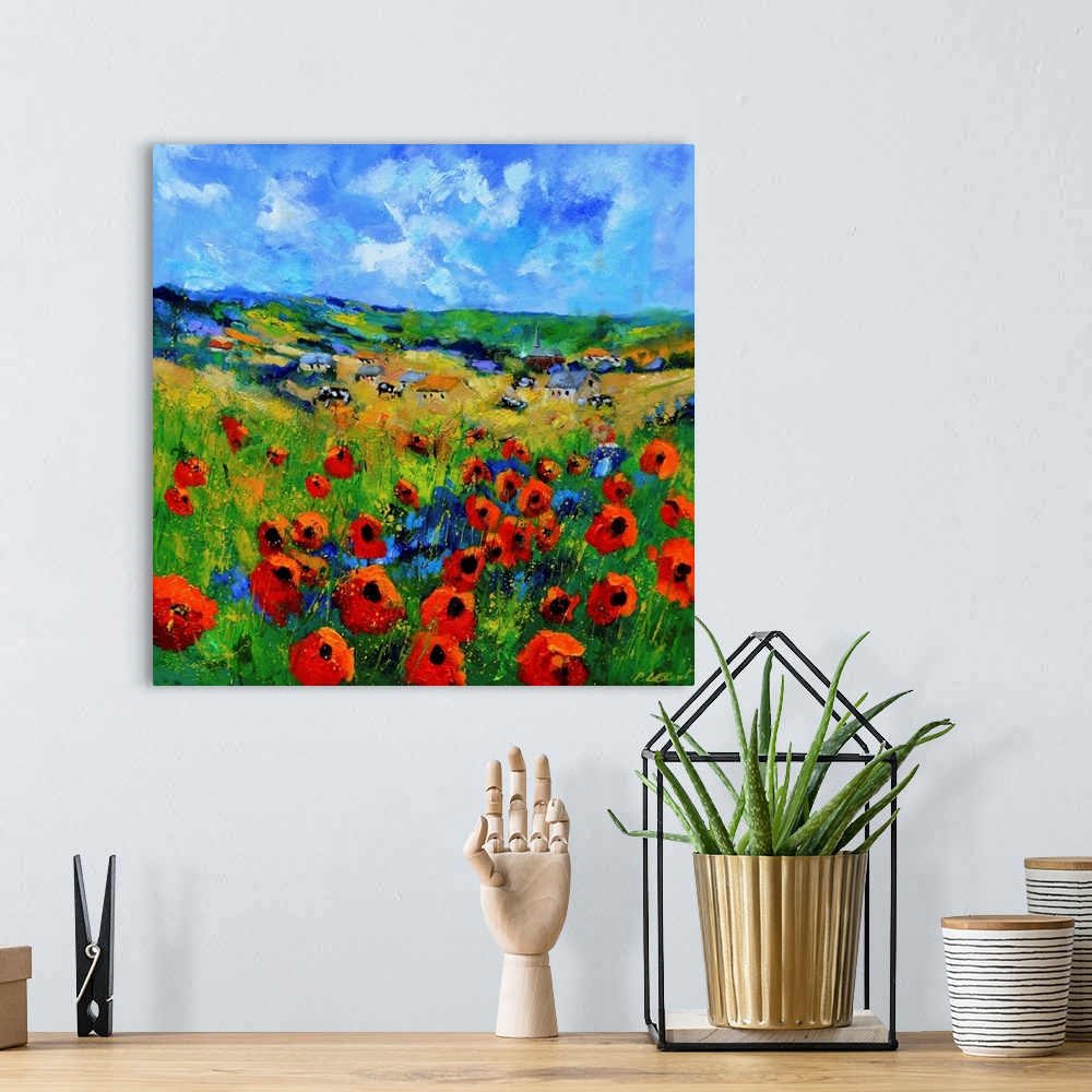A bohemian room featuring Contemporary abstract painting of a bright field of poppies.