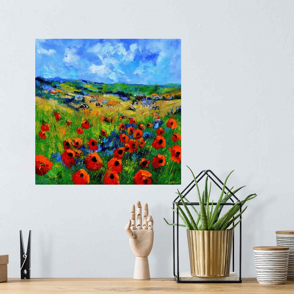A bohemian room featuring Contemporary abstract painting of a bright field of poppies.