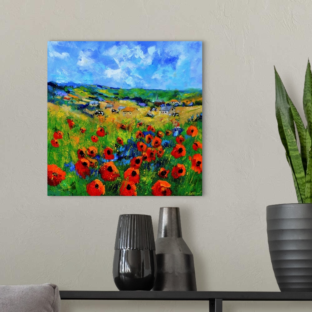 A modern room featuring Contemporary abstract painting of a bright field of poppies.