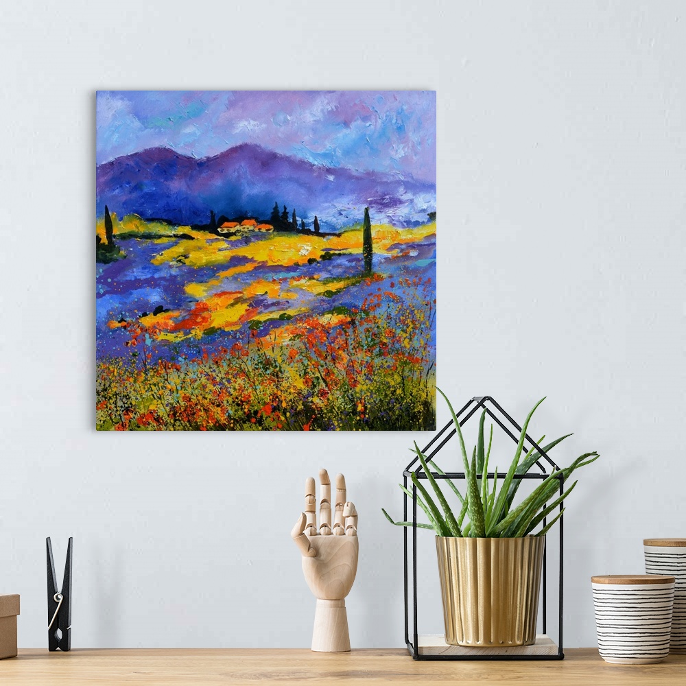 A bohemian room featuring Vibrant painting of a bright Summer day with blooming flowers in a field, a colorful sky, and vil...