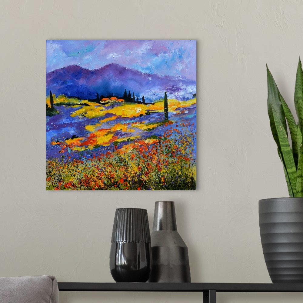 A modern room featuring Vibrant painting of a bright Summer day with blooming flowers in a field, a colorful sky, and vil...