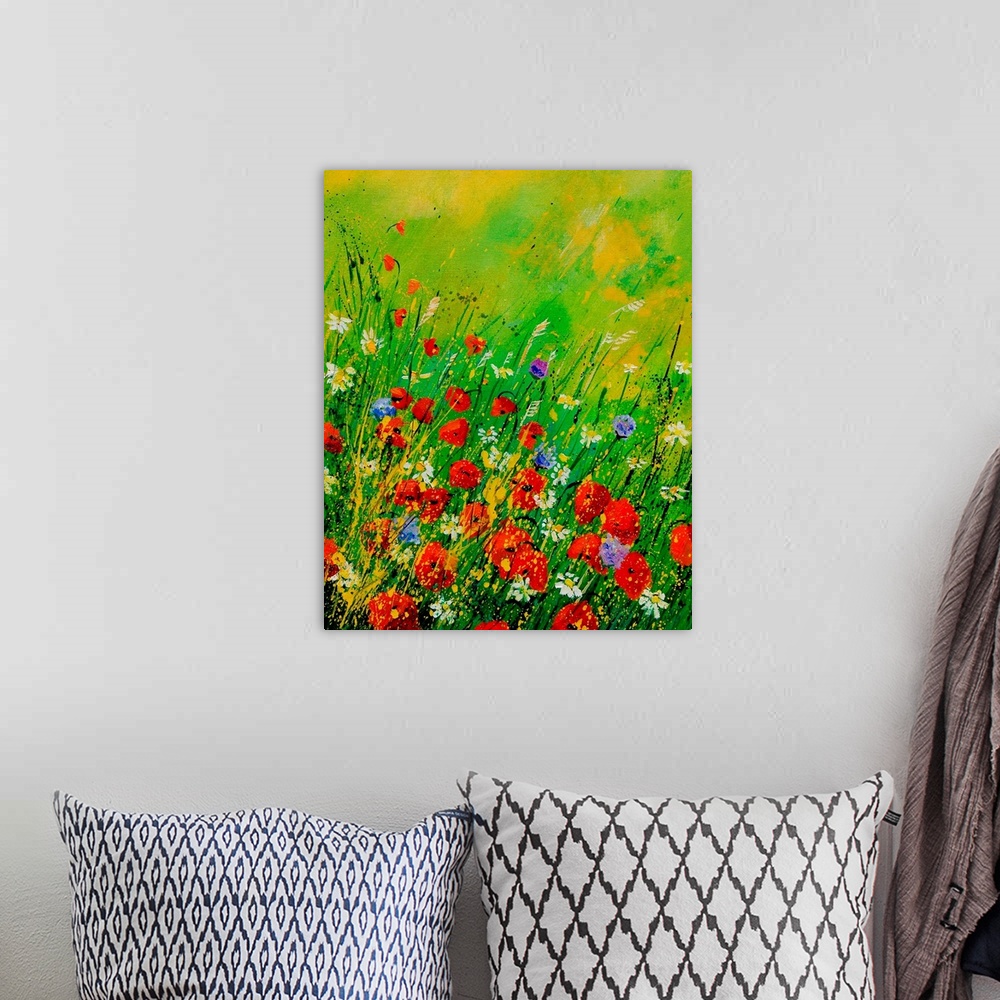A bohemian room featuring Vertical painting of a field of red poppies along with other wild flowers in bloom.
