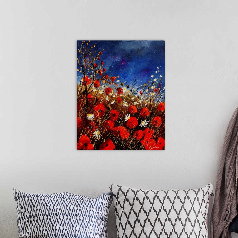 A bohemian room featuring Vertical painting of a field of red poppies with splatters of multi-color paint overlapping the i...