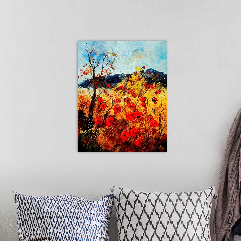 A bohemian room featuring Vertical painting with a field of red poppies in the foreground and a mountain in the background.