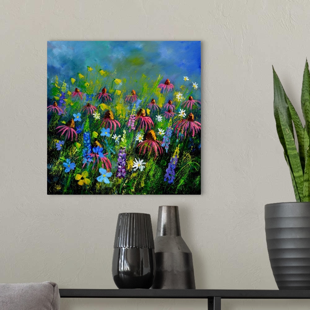 A modern room featuring Square painting of colorful flowers in a garden and a bright blue sky with small speckles of pain...