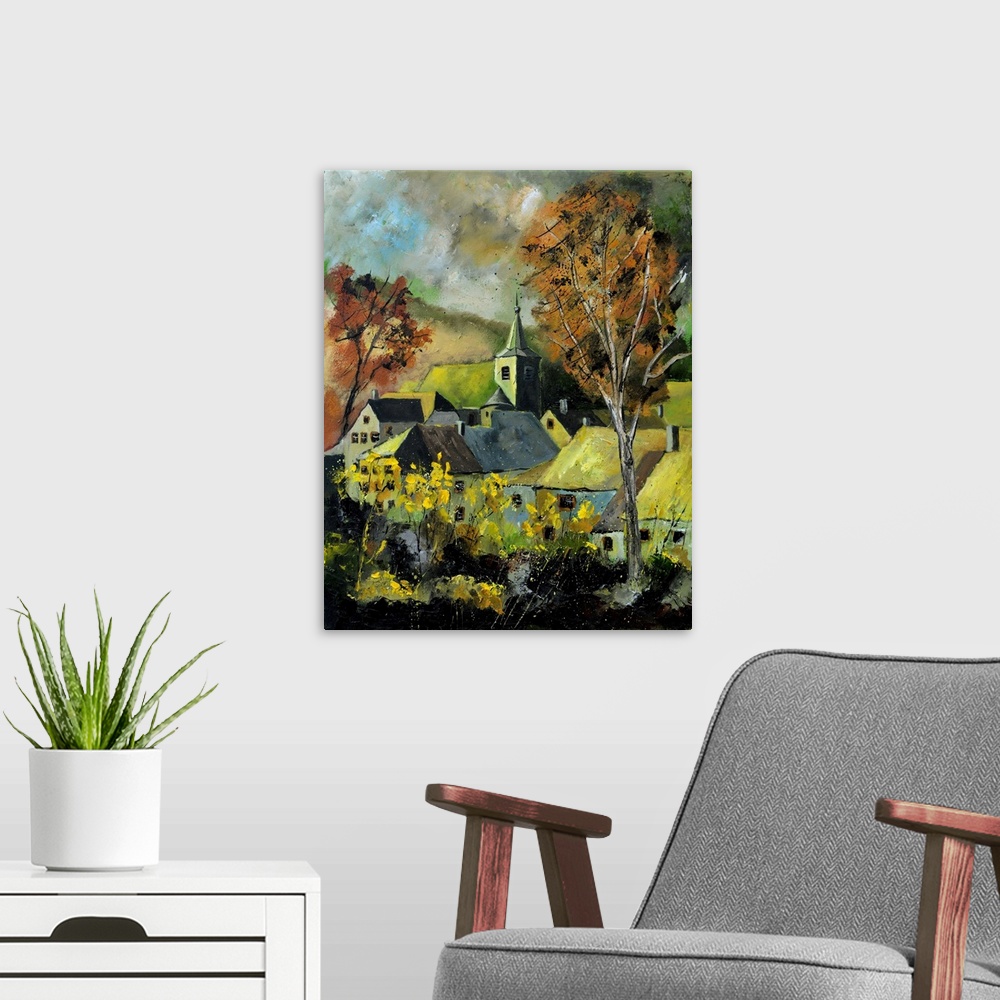 A modern room featuring Vertical painting of a darkened landscape with trees in the foreground and a Belgium village in t...