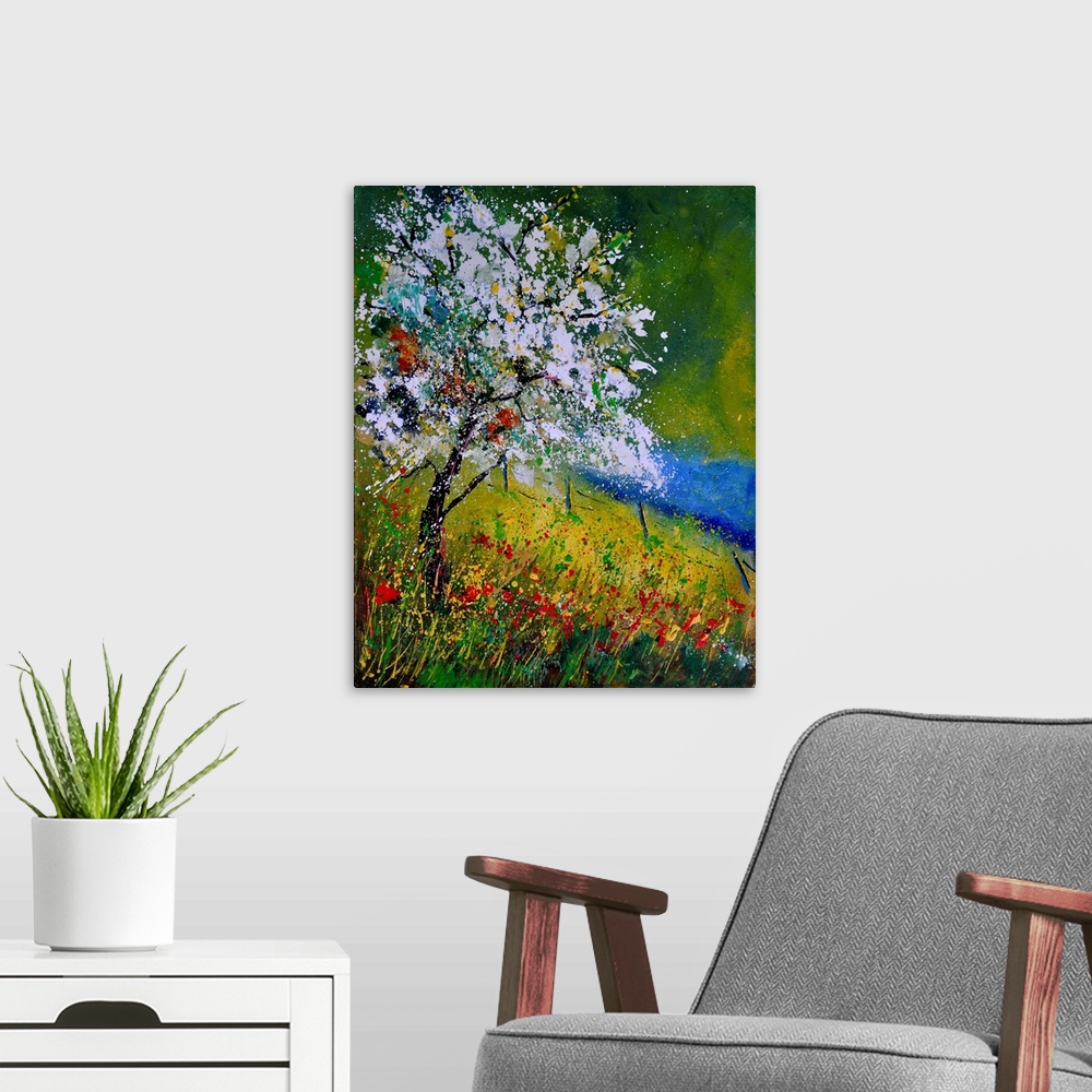 A modern room featuring Vertical painting of a tree covered in white blooming flowers along a field of wild flowers on a ...