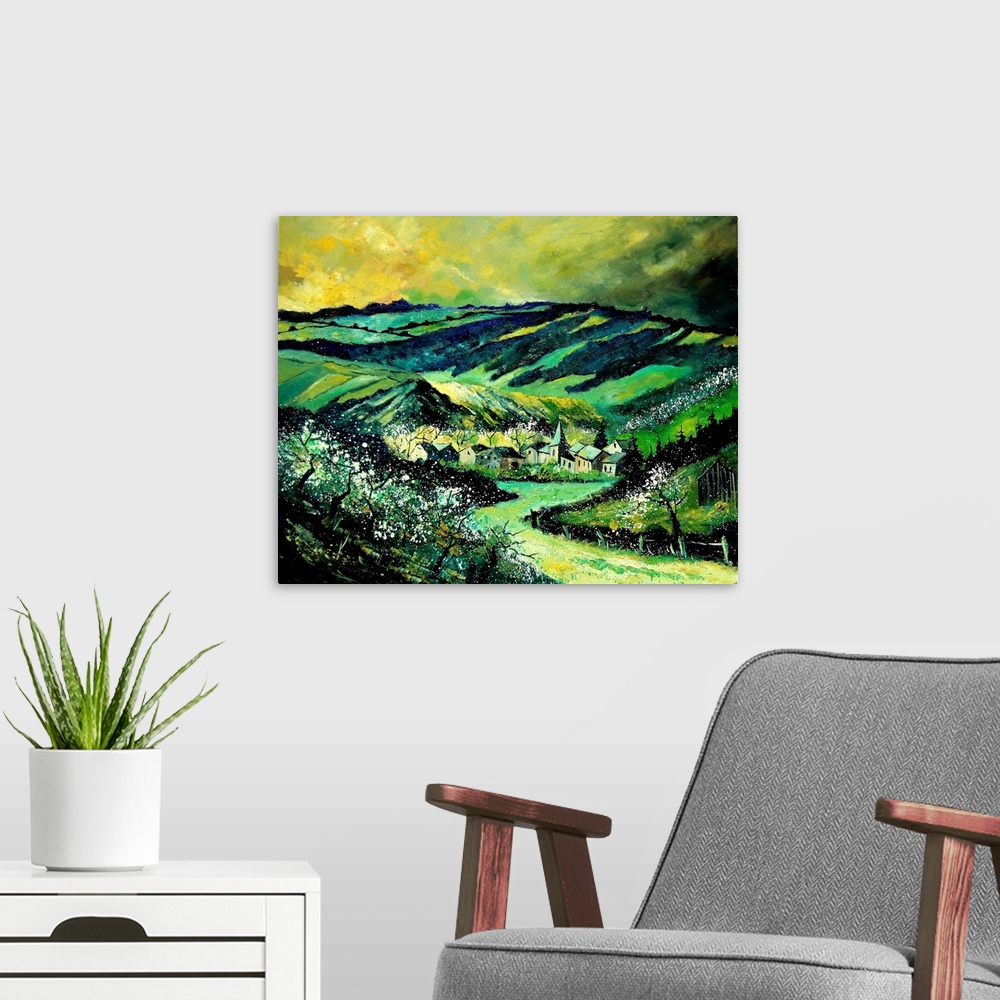 A modern room featuring A horizontal painting in vibrant colors of green of the village of Ardennes, Belgium.