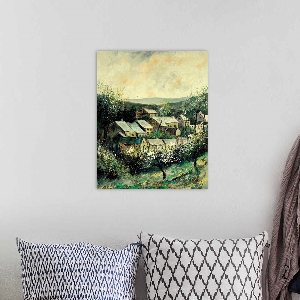A bohemian room featuring A vertical painting of the the village of Ardennes, Belgium during the springtime.