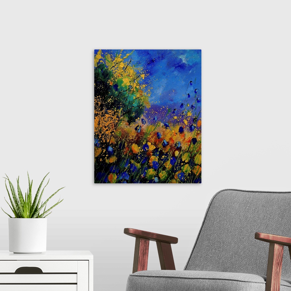A modern room featuring Vertical painting of a field of wild flowers with splatters of multi-color paint overlapping the ...