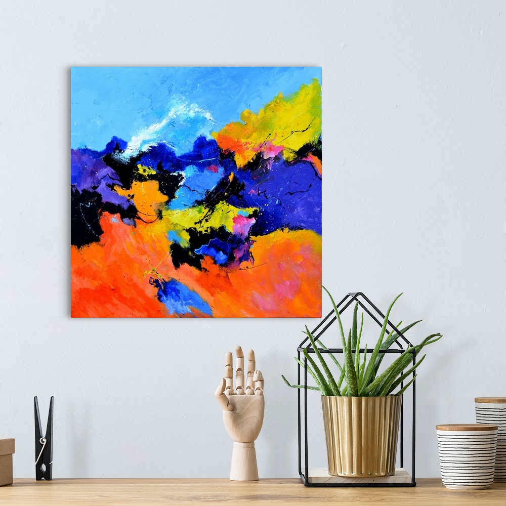 A bohemian room featuring Abstract painting with vibrant hues in shades of orange, yellow, blue, pink, purple, and white mi...
