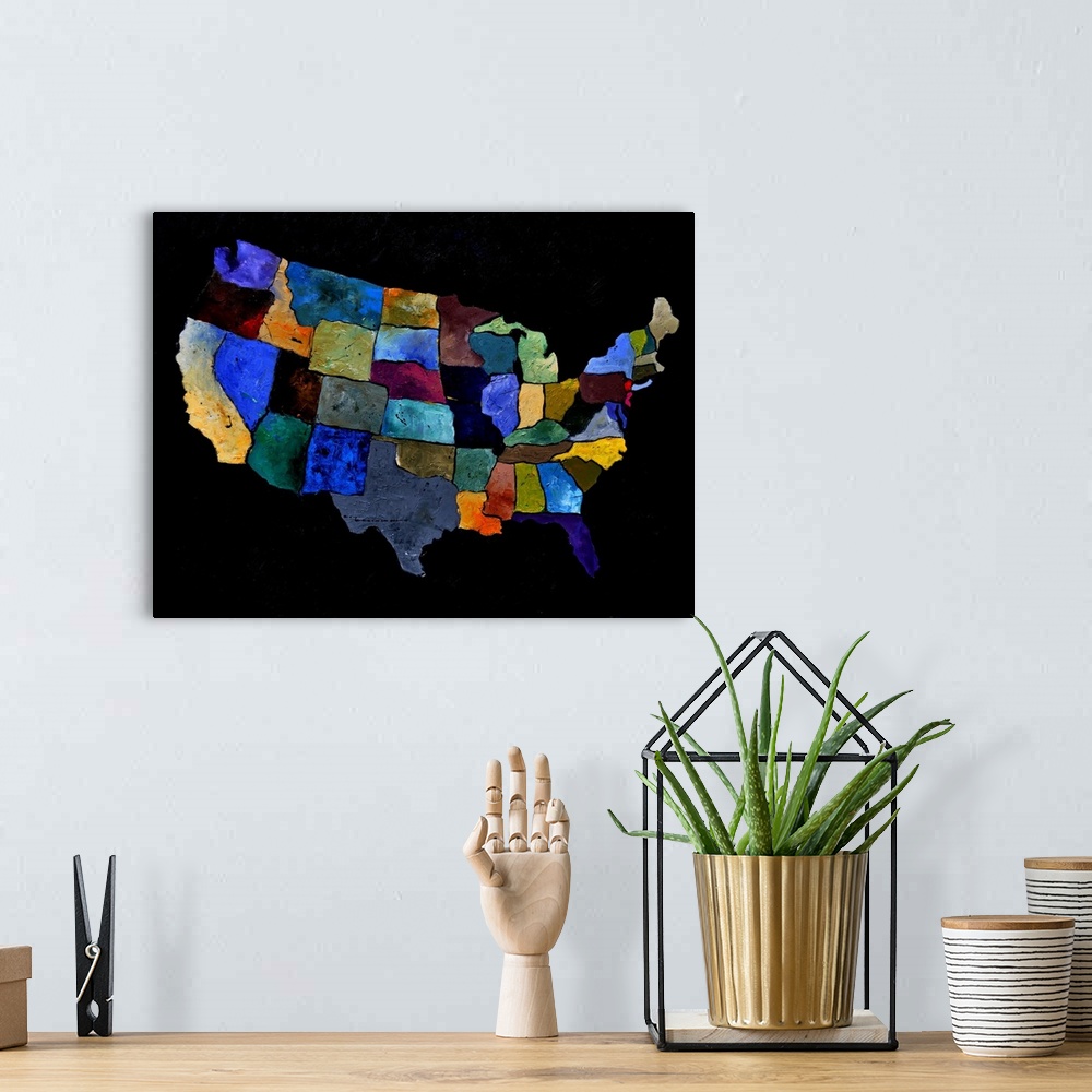 A bohemian room featuring Painting of the United States of America in multi-color paints against a black background.