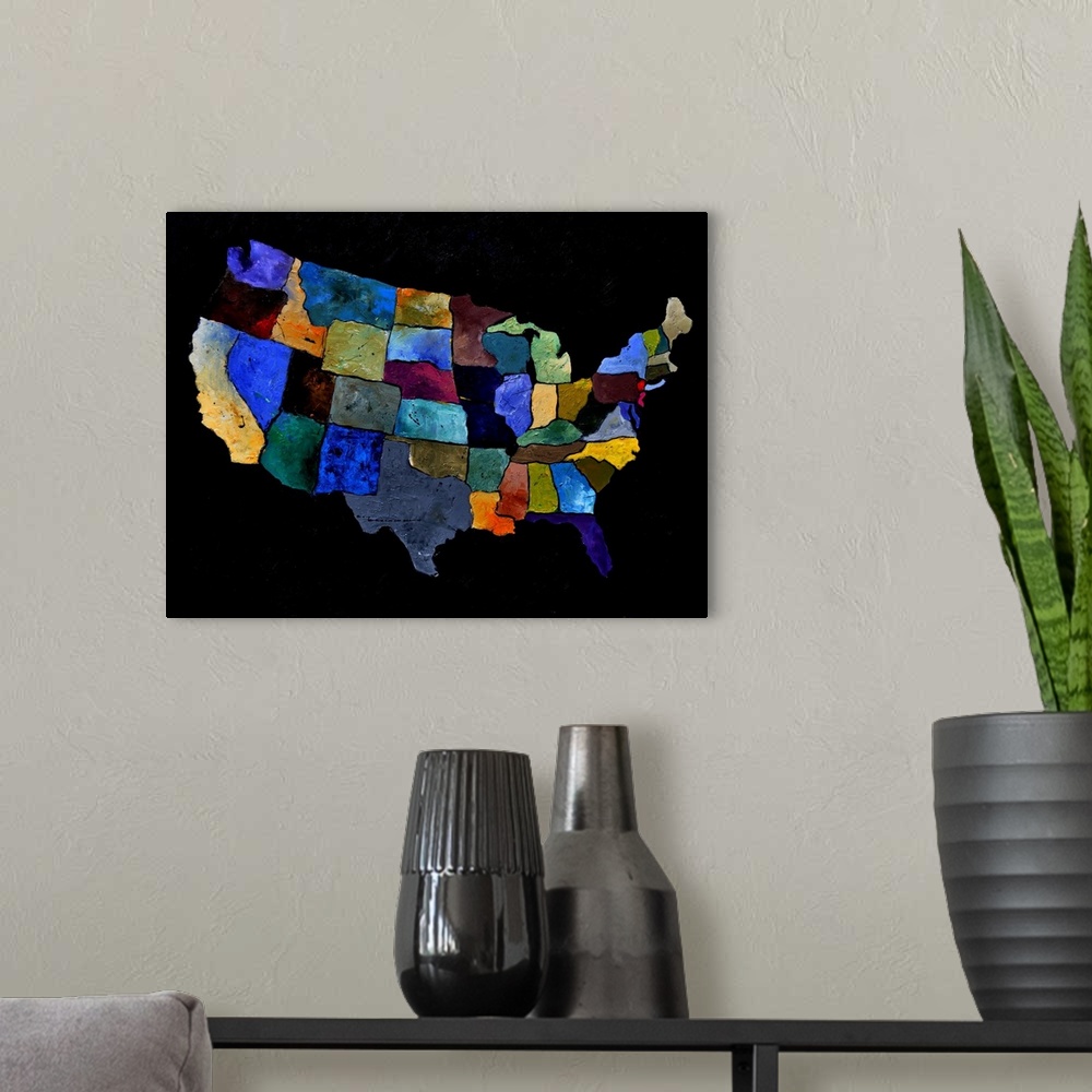 A modern room featuring Painting of the United States of America in multi-color paints against a black background.