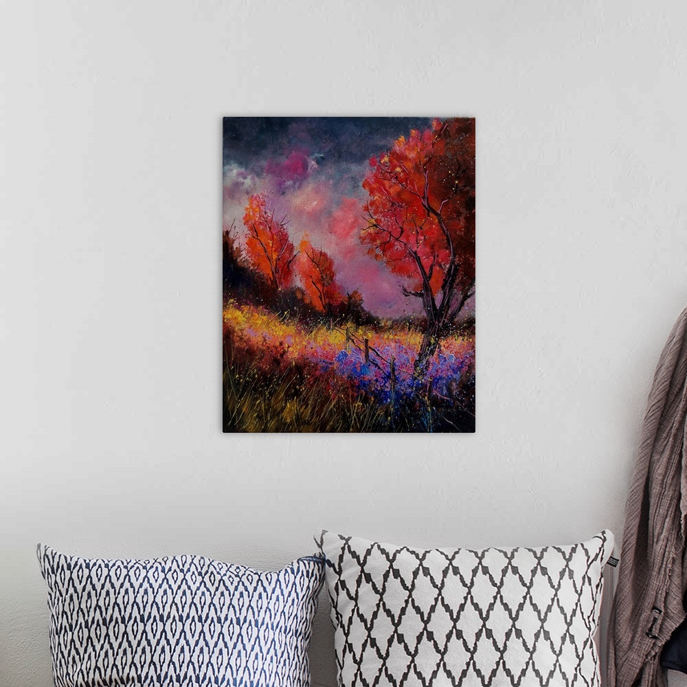 A bohemian room featuring Vertical painting of a field with red leaved trees and splatters of multi-color paint overlapping...