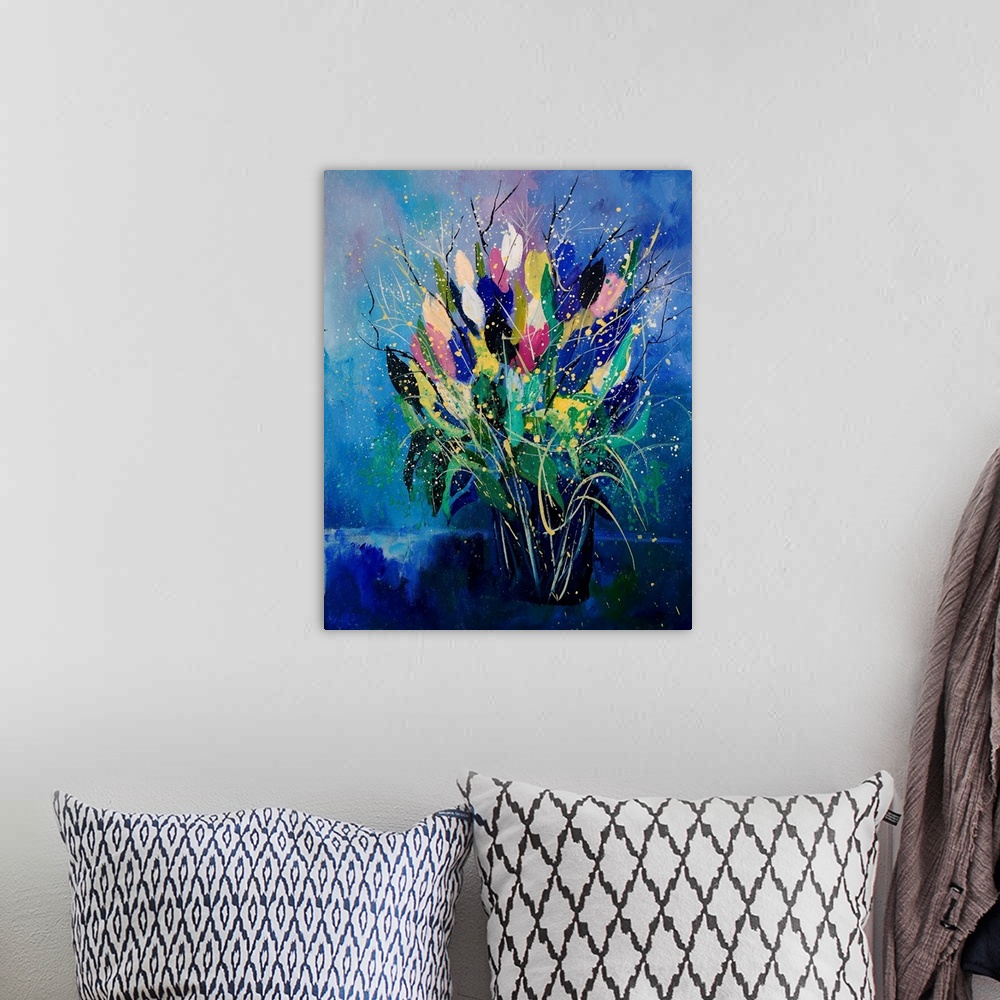 A bohemian room featuring Vertical painting of a bouquet of colorful tulips in a vase against a blue backdrop.