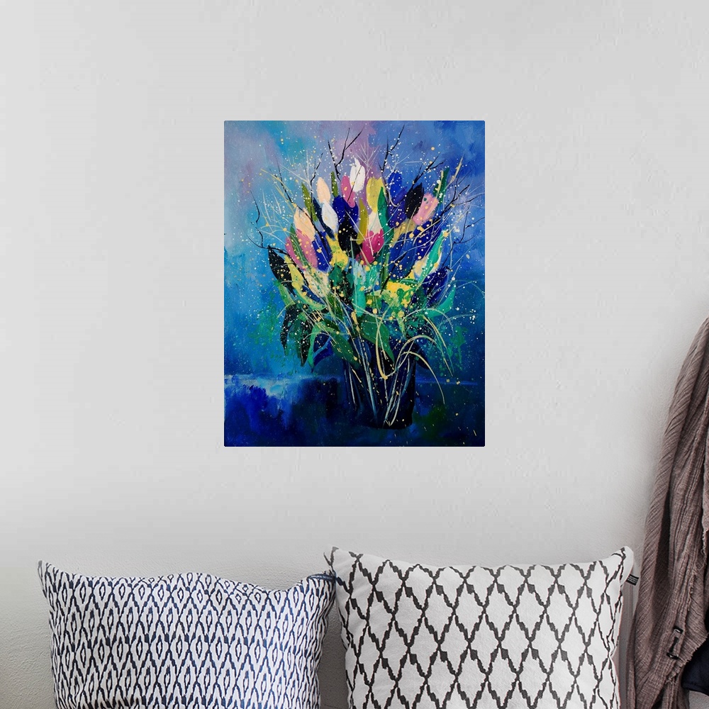 A bohemian room featuring Vertical painting of a bouquet of colorful tulips in a vase against a blue backdrop.