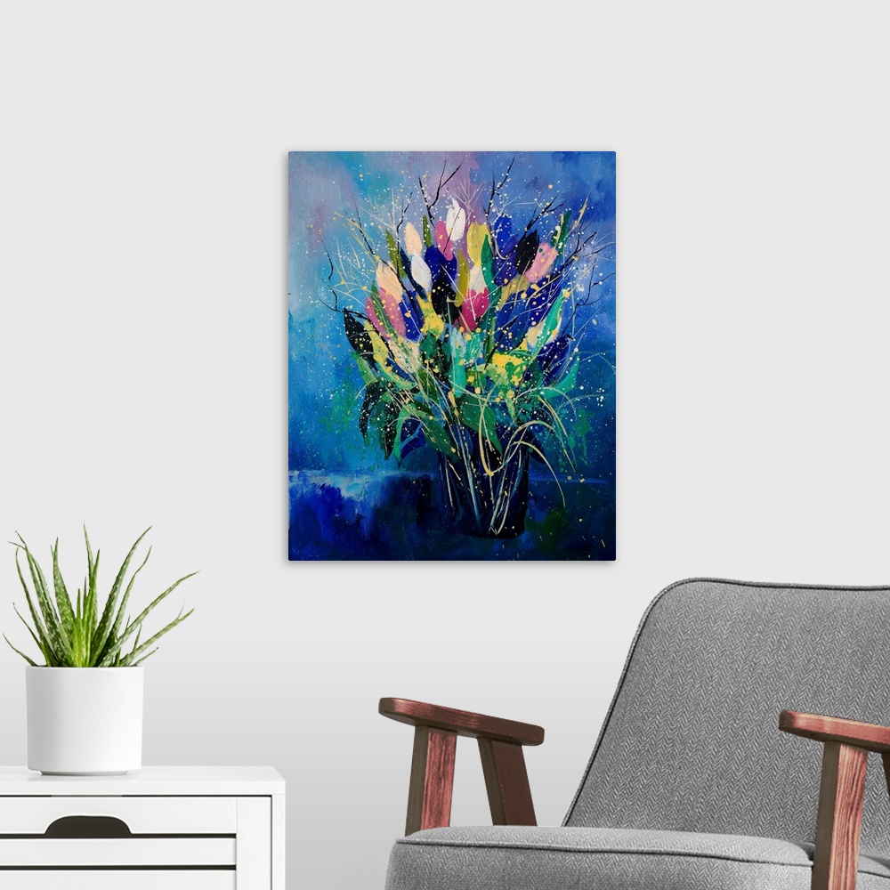 A modern room featuring Vertical painting of a bouquet of colorful tulips in a vase against a blue backdrop.