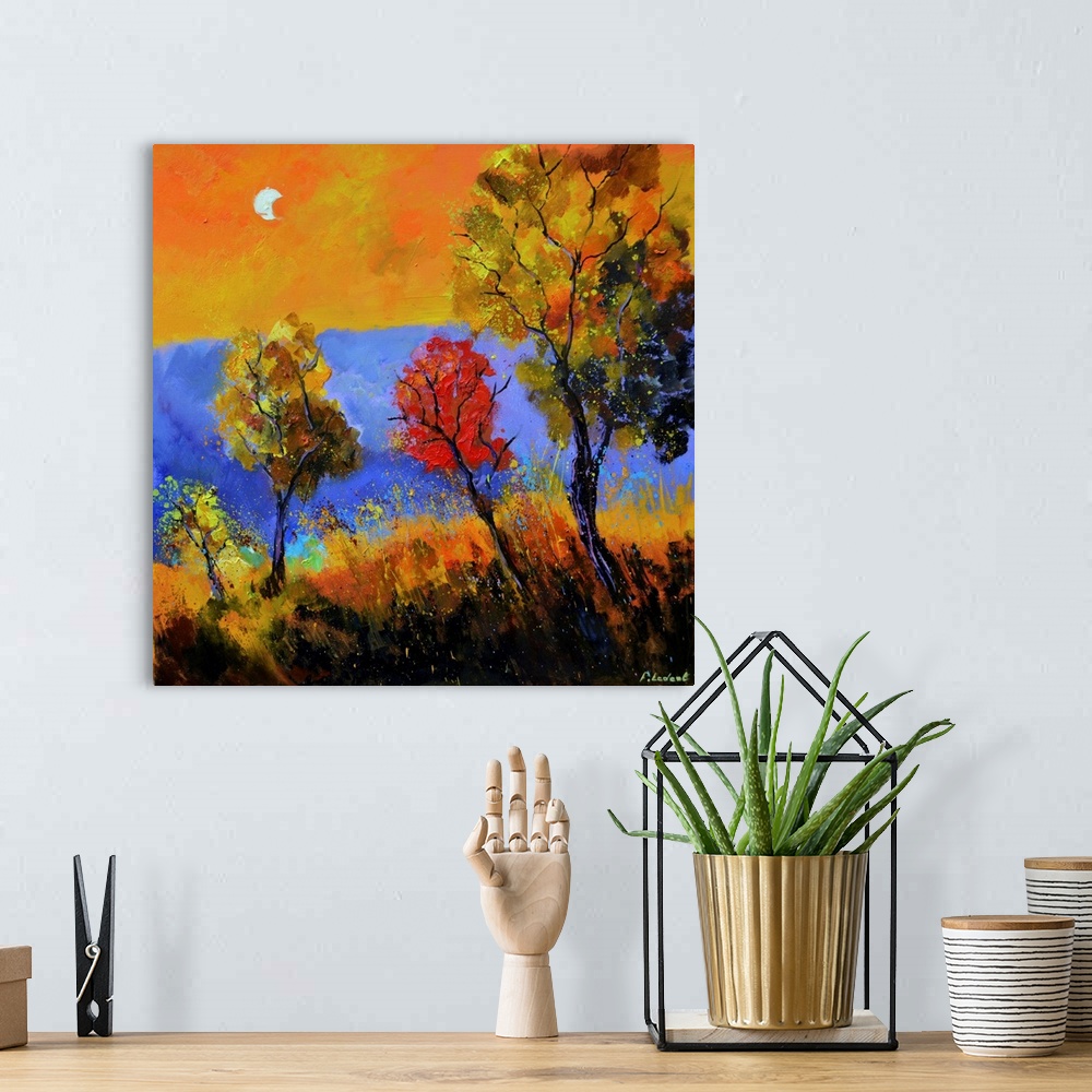 A bohemian room featuring Square painting with Autumn trees with a purple and orange background and a bright moon in the sky.