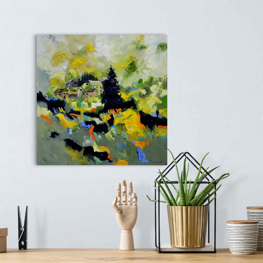 A bohemian room featuring Contemporary painting of a village in Belgium surrounded by an abstract landscape.